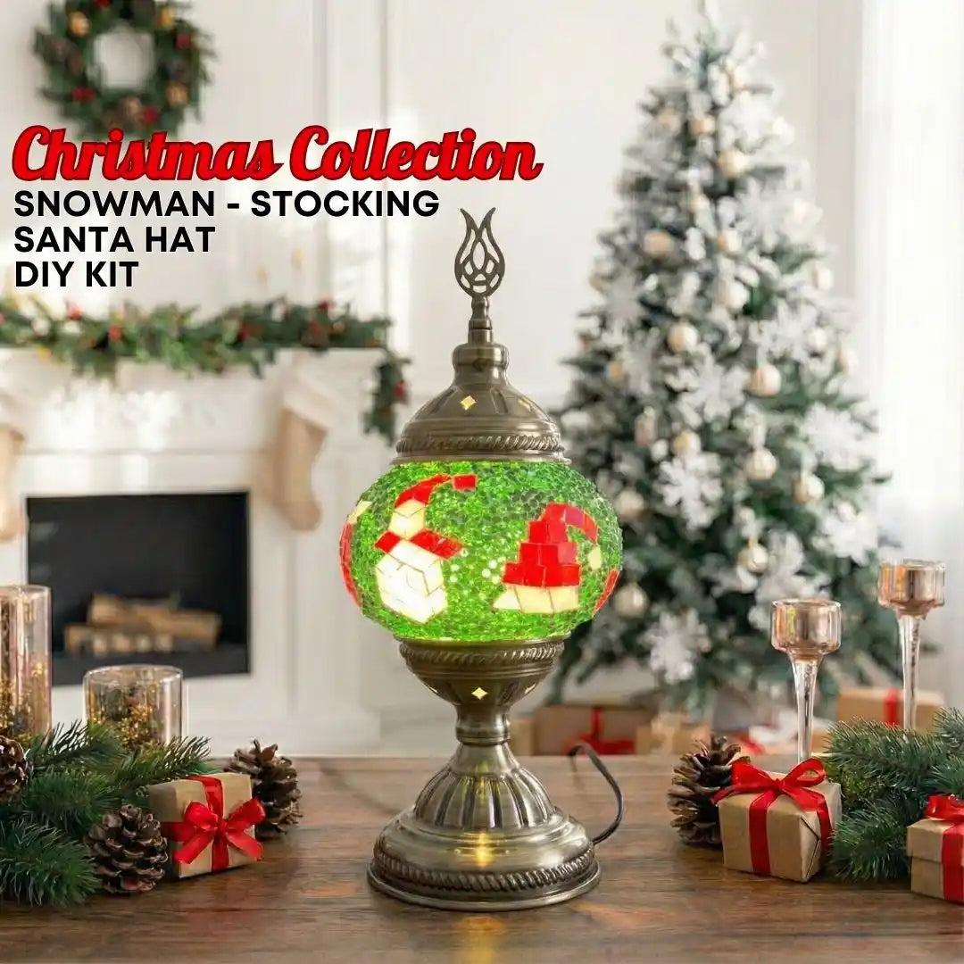 Decorative lamp with Christmas-themed design on a table with festive decorations.