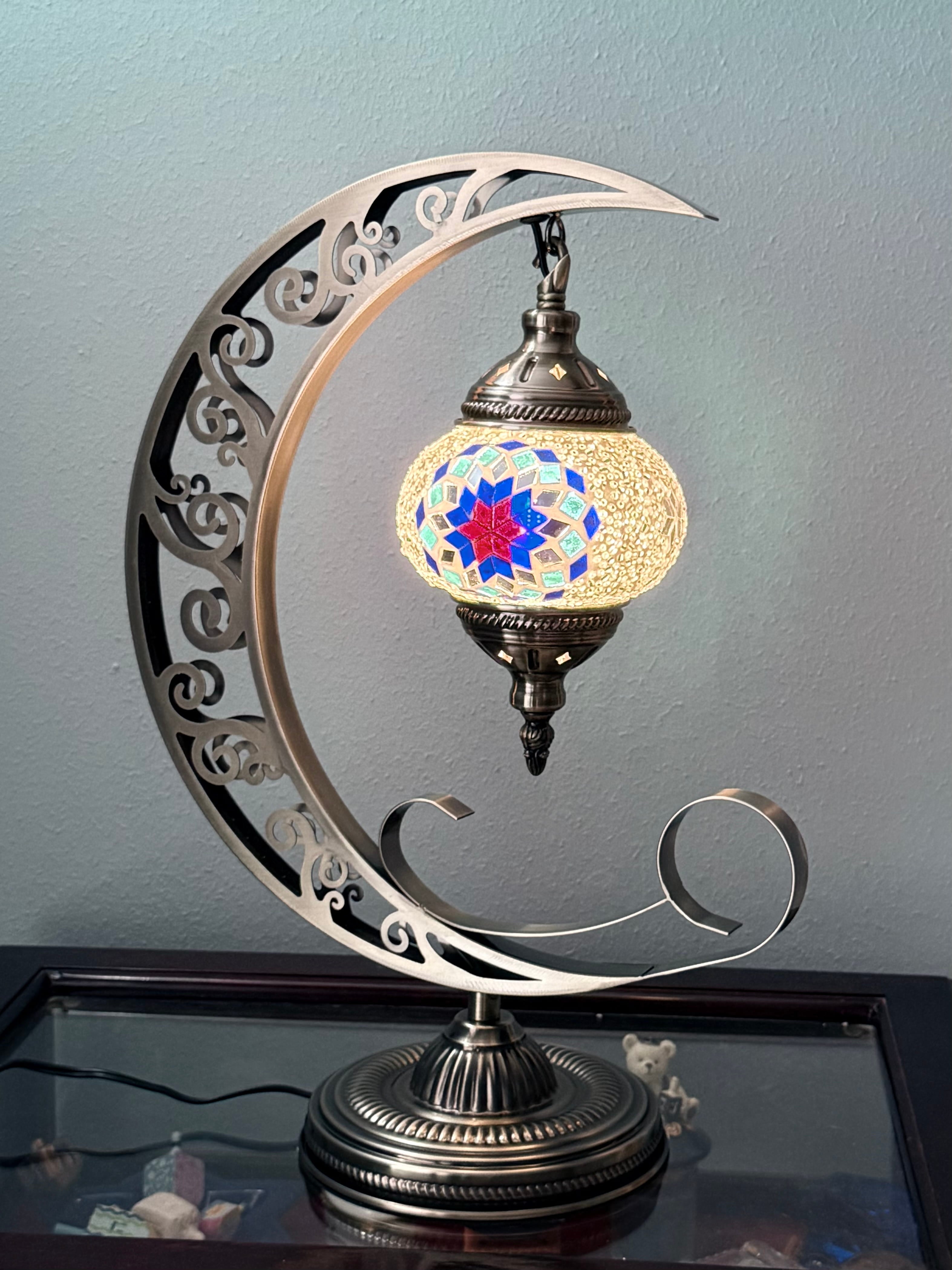 Decorative moon lamp with a crescent moon design on a plain background