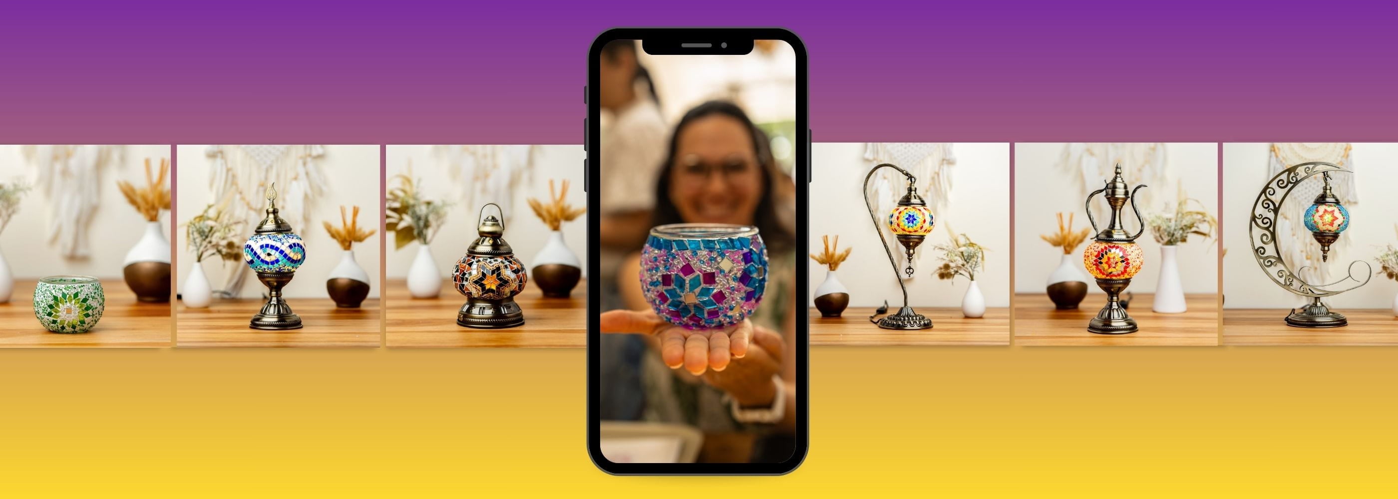 Smartphone displaying a person holding a colorful glass vase with decorative items on a table in the background.