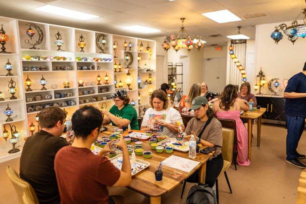 Guests making Turkish mosaic lamps together at a Pedalisa Art studio workshop