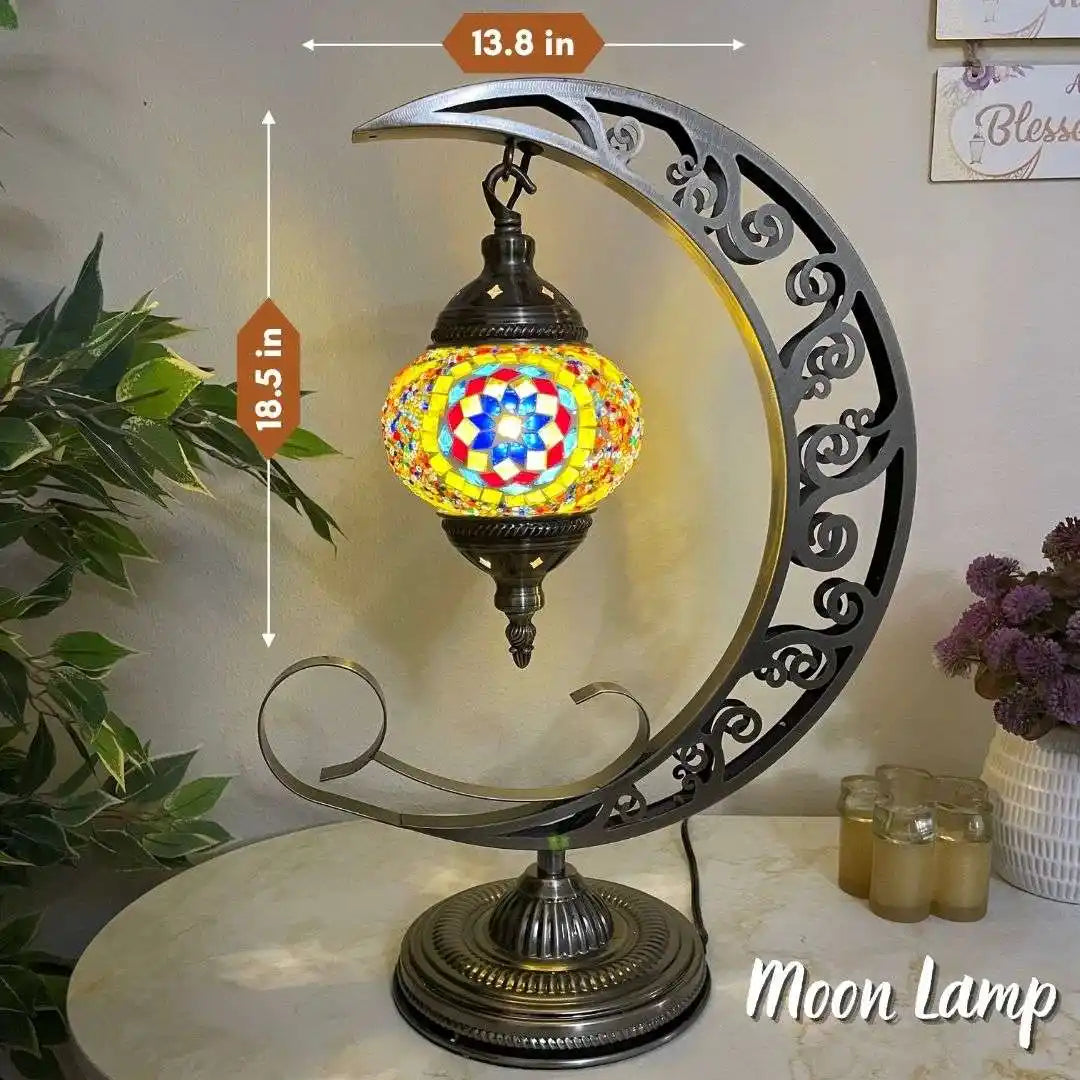 Decorative Turkish Moroccan mosaic moon lamp with colorful mosaic design on a table.