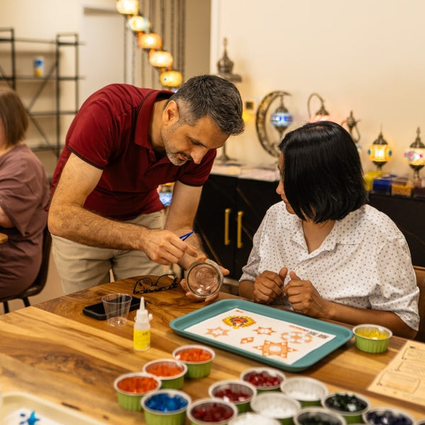 Guest learning mosaic lamp making at Pedalisa Art workshop — no experience needed