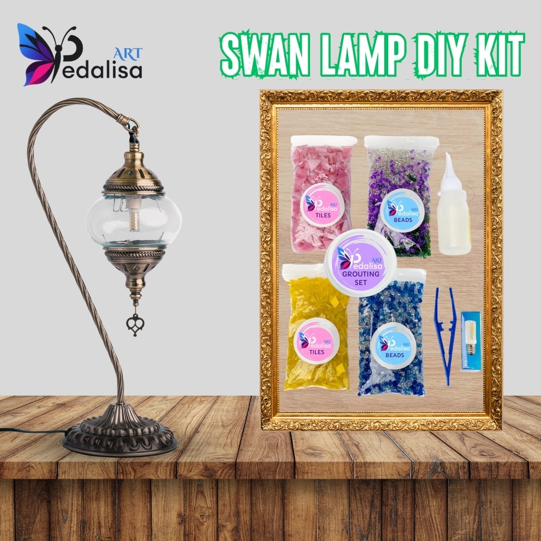 Swan lamp DIY kit with materials and tools on a wooden surface