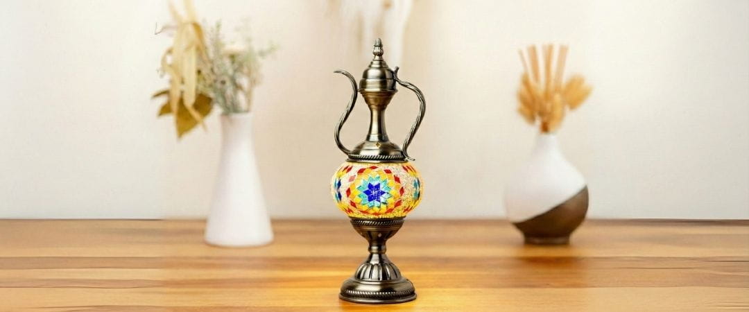 Decorative aladdin lamp with mosaic design on a wooden surface